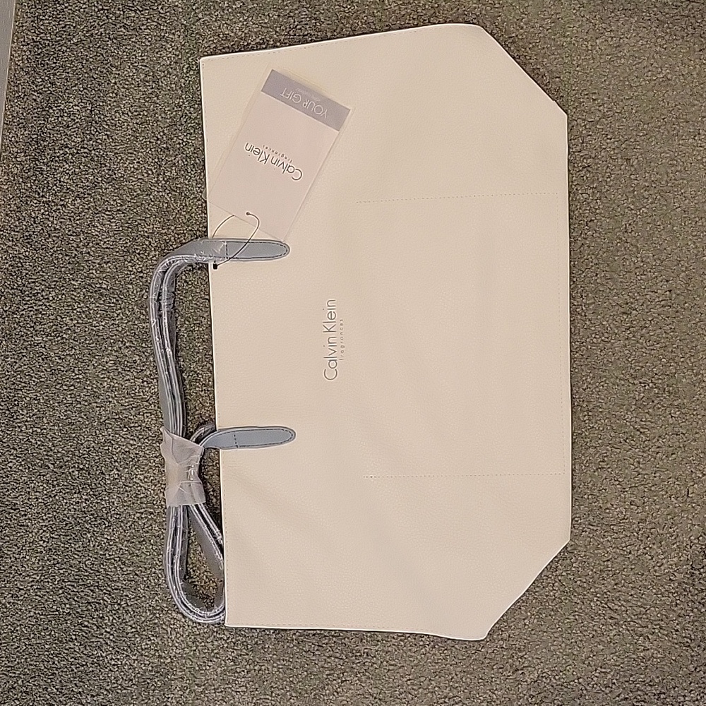 Soft white leather Calvin Klein tote with blue gray straps and edges NWT